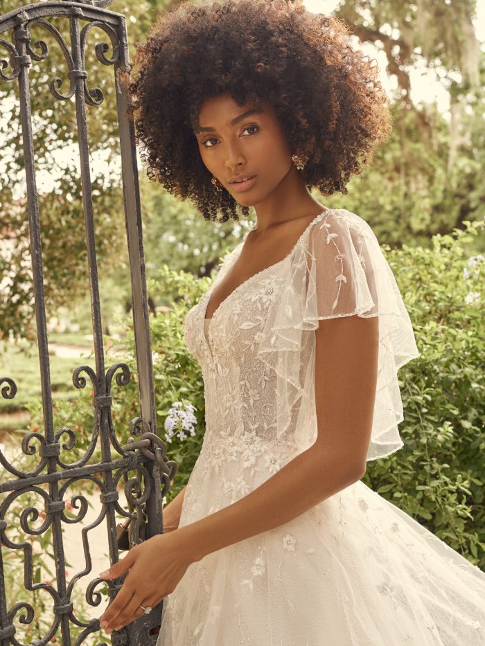 Bride Wearing Flutter Sleeve A-line Bridal Dress for Pear-Shaped Body Types Called Paige by Maggie Sottero