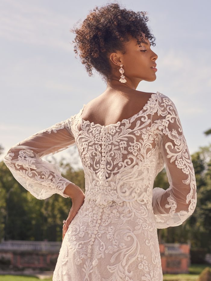Bride Wearing Lace Bridal Jacket Over Strapless Wedding Dress Called Sedona by Maggie Sottero