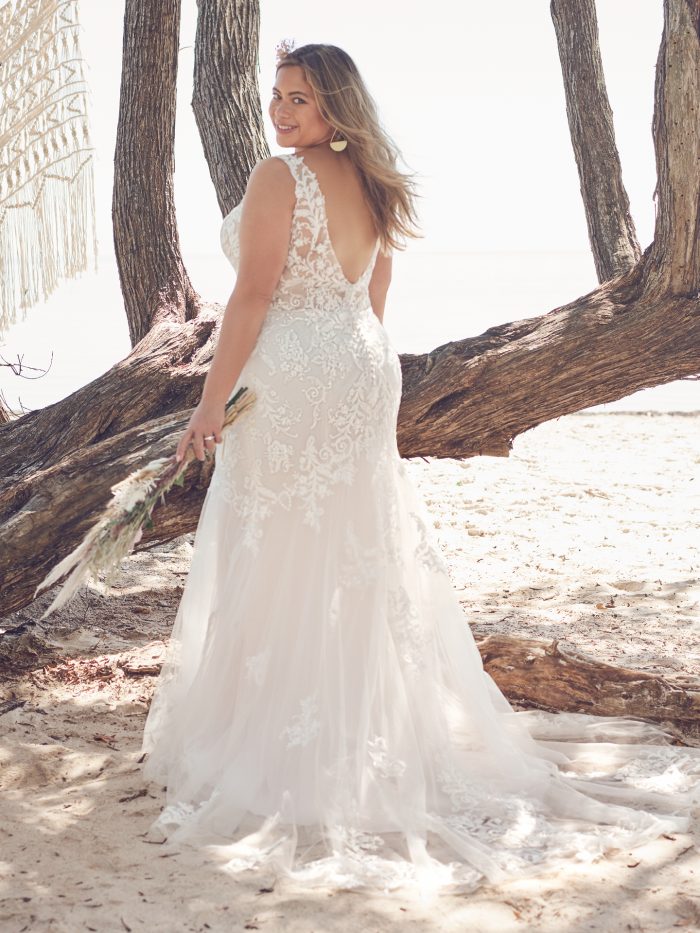 Bride Wearing Plus-Size Sparkly V-neck Mermaid Wedding Dress Called Faustine by Rebecca Ingram