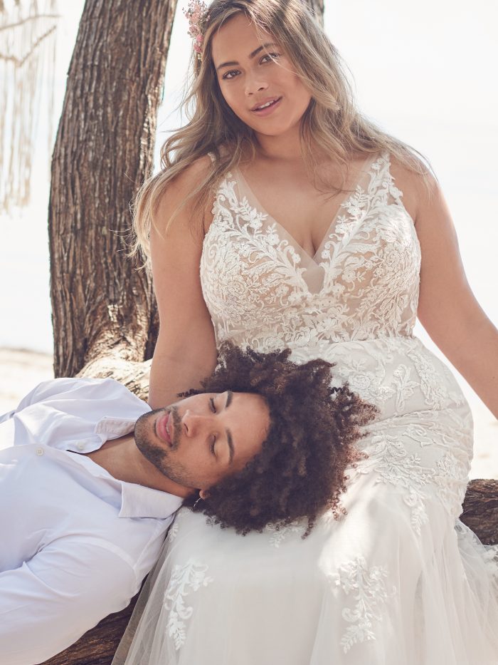 Bride with Groom Wearing Plus-Size Sparkly V-neck Mermaid Wedding Dress Called Faustine by Rebecca Ingram