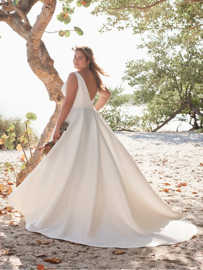 Bride Wearing Plus-Size Satin Ball Gown Wedding Dress Called Pearl by Rebecca Ingram