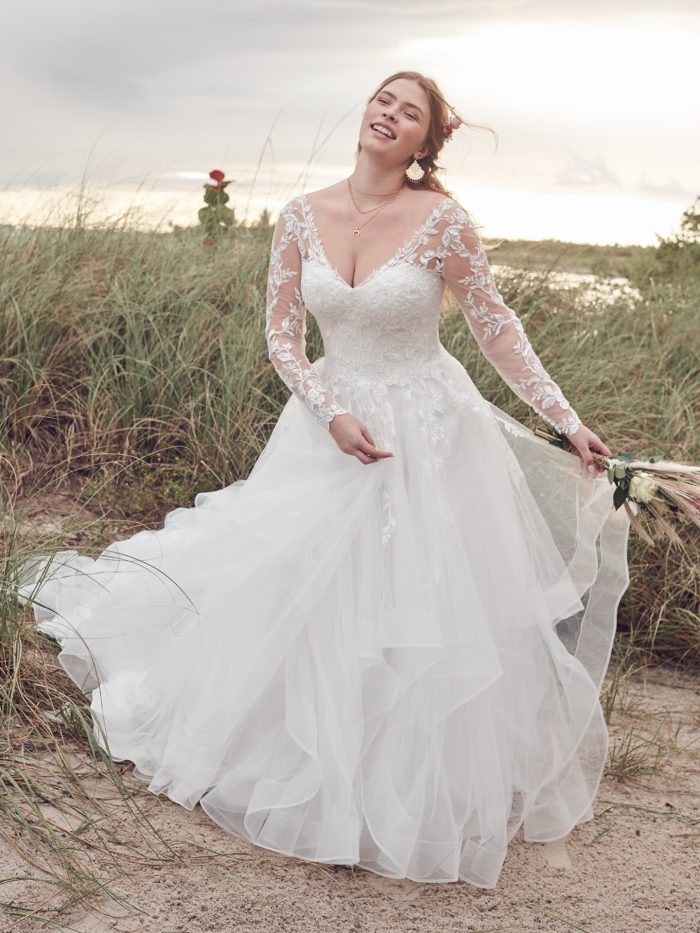 Bride Wearing Romantic Long Sleeve Ball Gown Wedding Dress Called Tessa by Rebecca Ingram