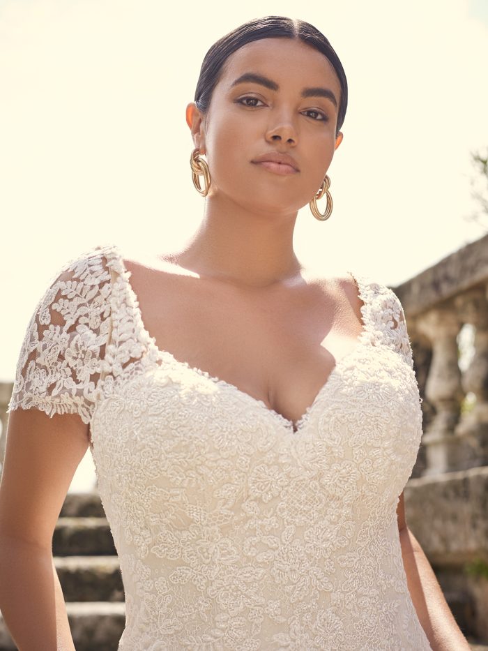 Bride Wearing Plus Size Lace Wedding Dress with Detachable Vintage Lace Cap Sleeves Called Dublin Lynette by Sottero and Midgley