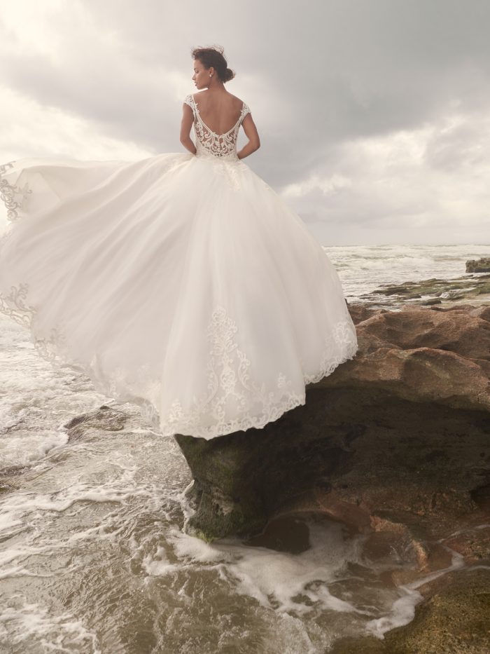 Bride on Beach Wearing Wedding Dress with Overskirt Called Jada by Sottero and Midgley