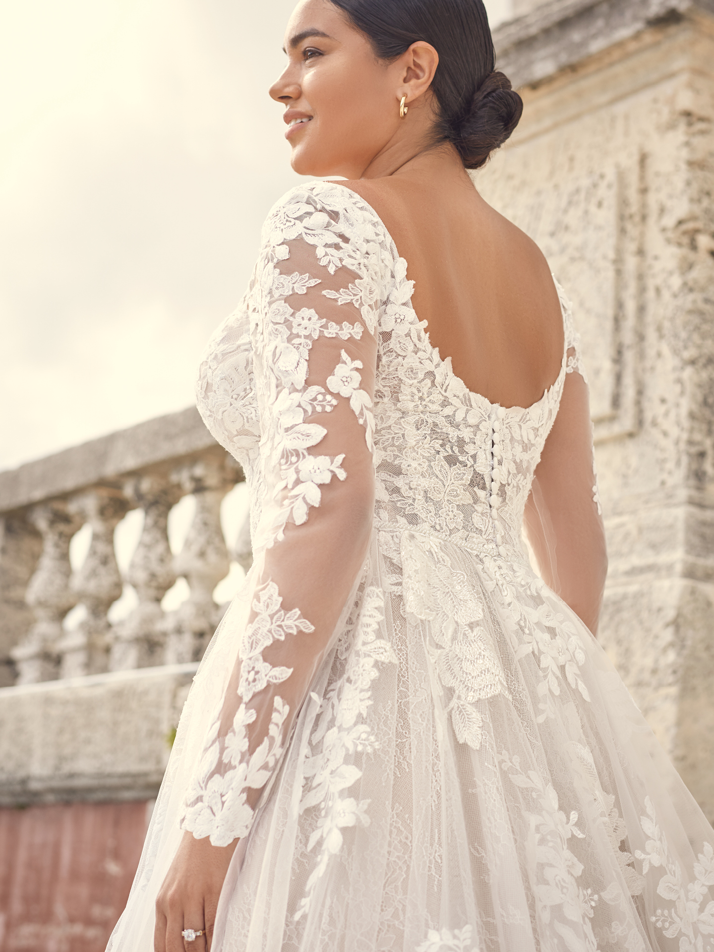 Bride Wearing Long Sleeve Floral Lace Wedding Gown Called Valona by Sottero and Midgley