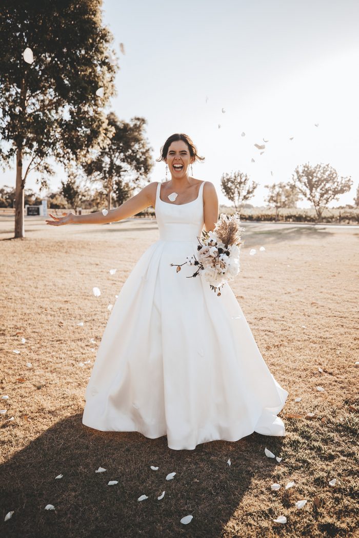Bride Wearing Modern Square Neck Satin Wedding Gown Called Selena by Maggie Sottero