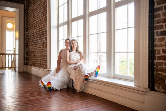 Real Brides at LGBTQ Wedding Wearing Rainbow-Showed Shoes for Pride Wedding Idea