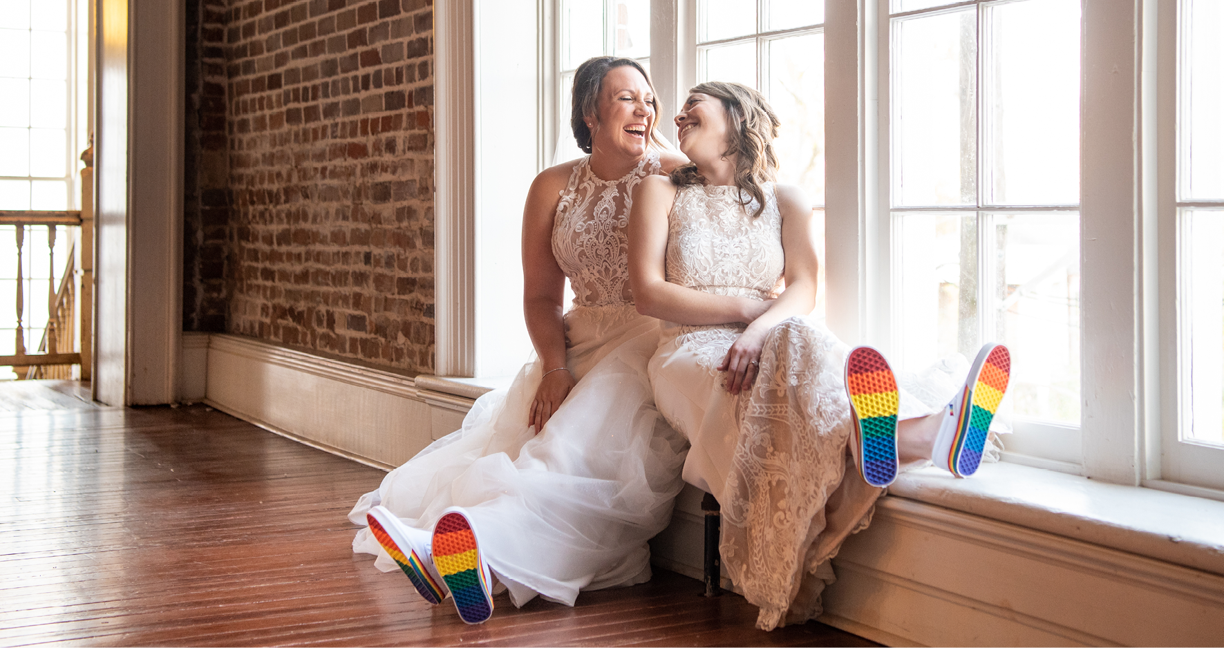 LGBTQ Brides Sitting Together and Wearing Rainbow-Soled Shoes for Pride Wedding Idea