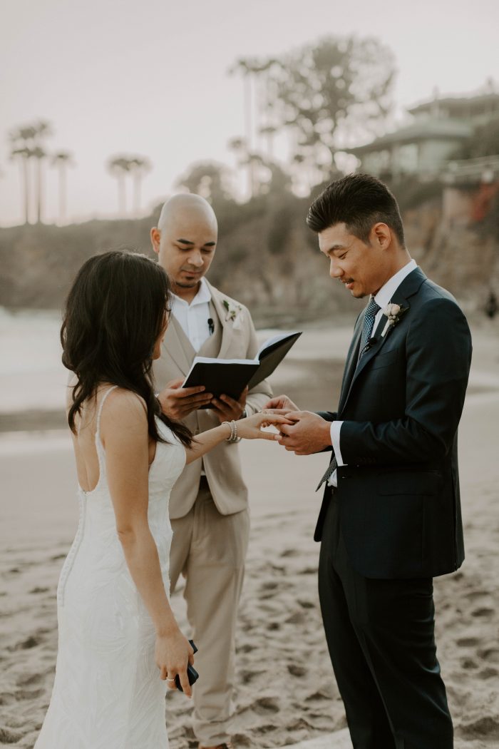 Bride and Groom Exchanging Rings at Casual Beach Wedding
