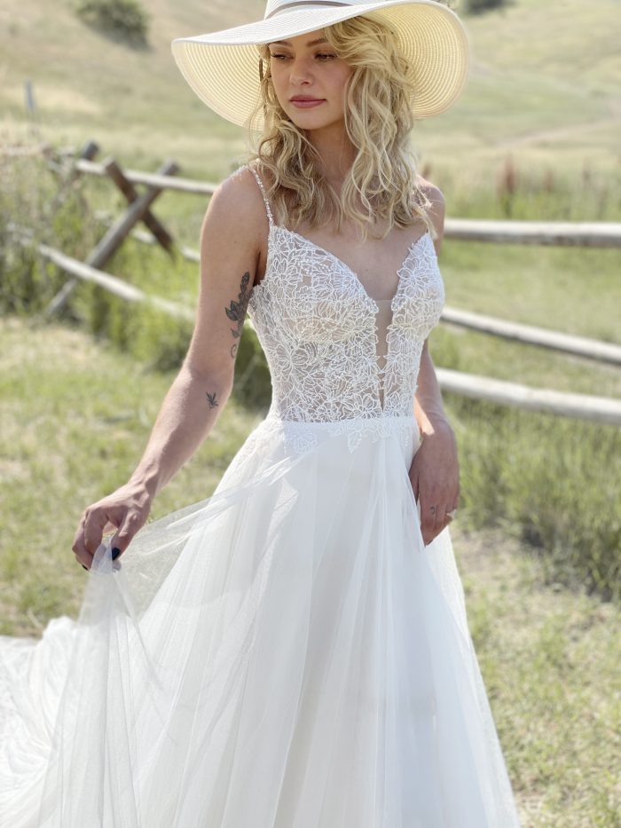 Bride in Field Wearing Chiffon A-line Cottagecore Wedding Dress Called Greta by Rebecca Ingram