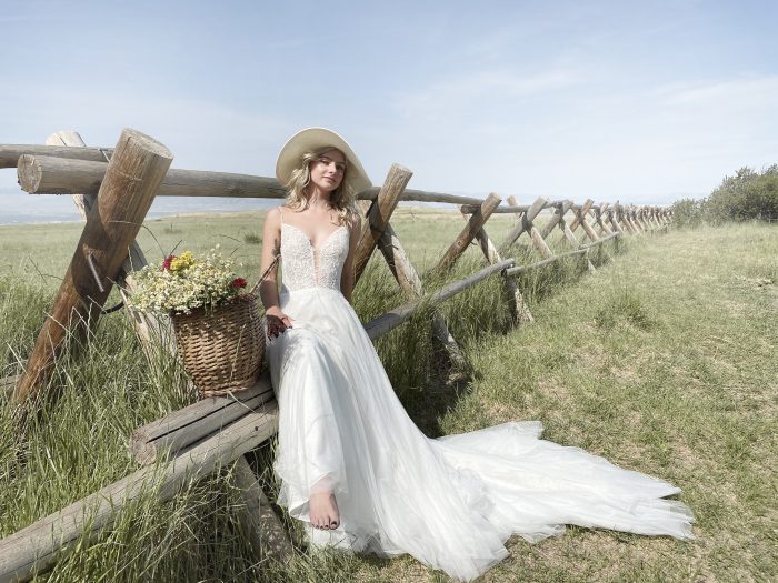 Bride in Field Wearing Chiffon A-line Cottagecore Wedding Dress Called Greta by Rebecca Ingram