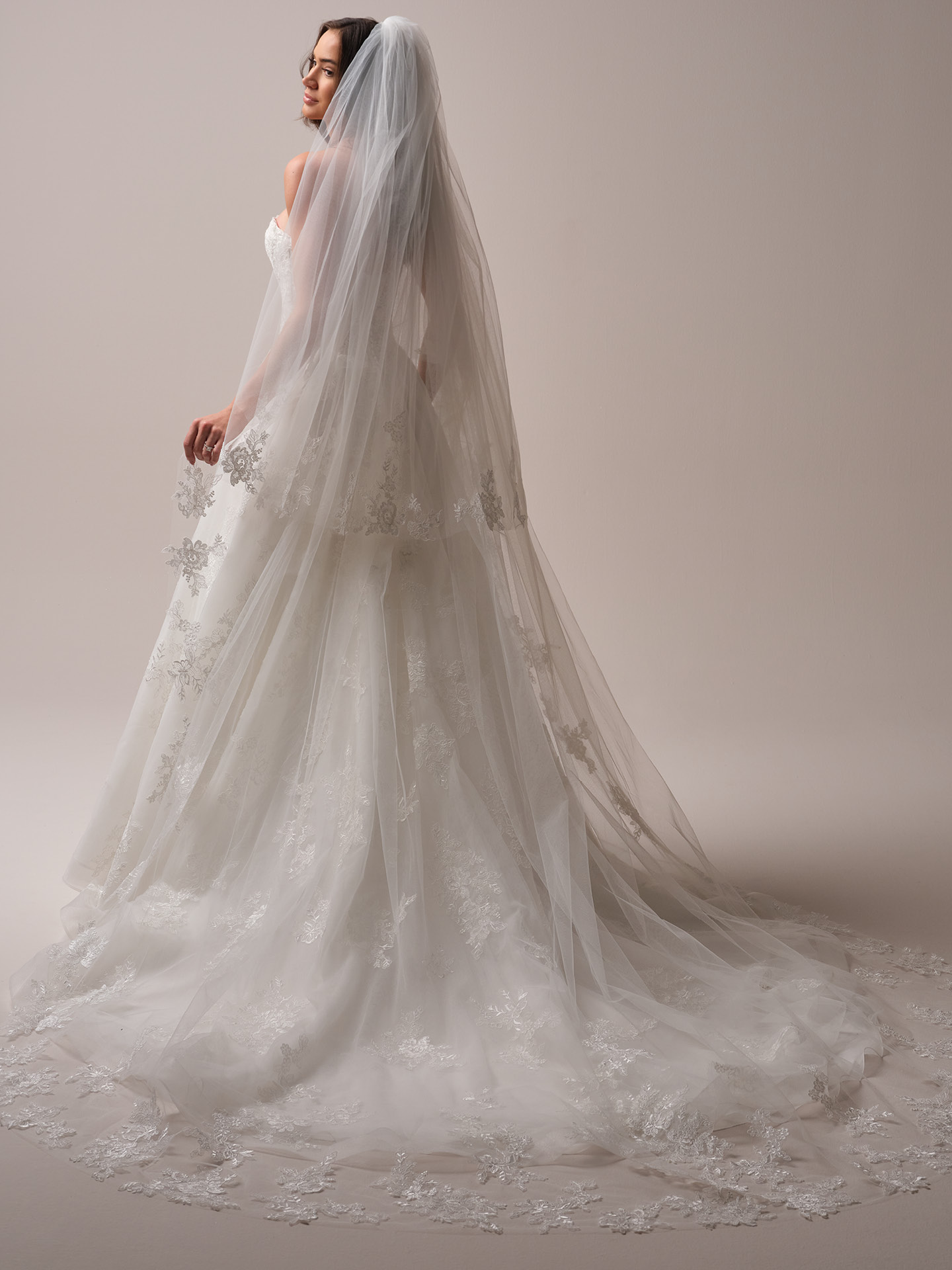 Back view of Maggie Sottero Prescott veil lace cathedral veil with blusher paired with a lace A-line wedding dress.