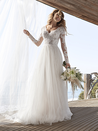 Bride Wearing Lace Long Sleeve Cottagecore Wedding Gown Called Iris by Rebecca Ingram