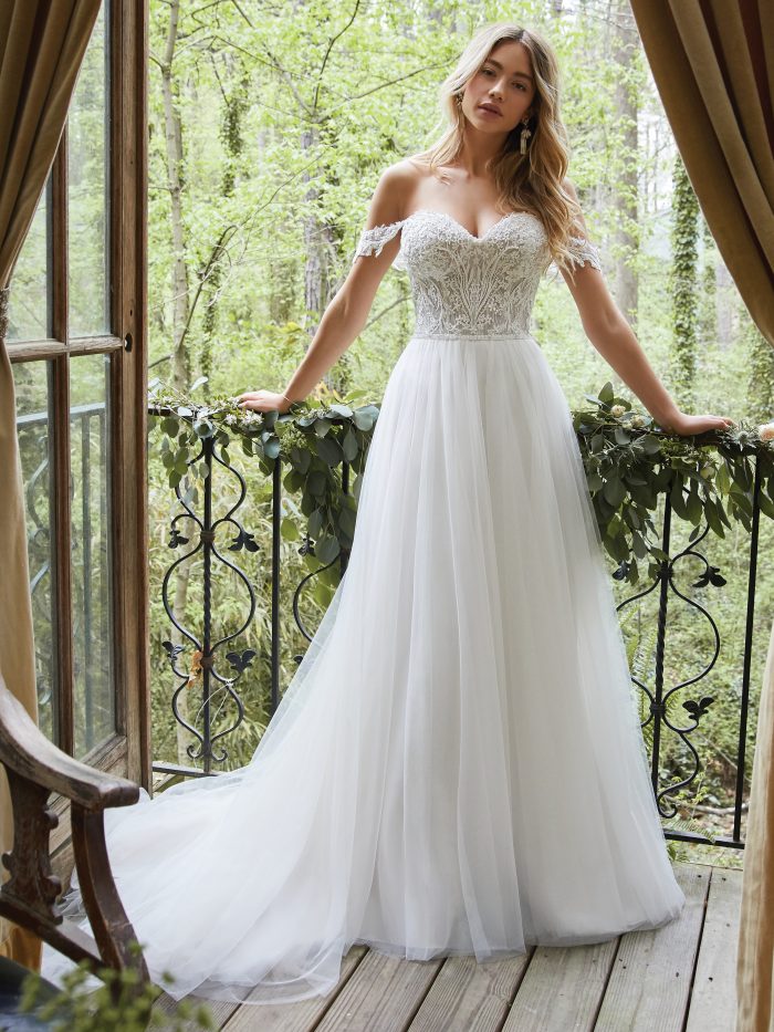 Bride Wearing A-line Cottagecore Wedding Dress Called Nia by Rebecca Ingram in the Forest