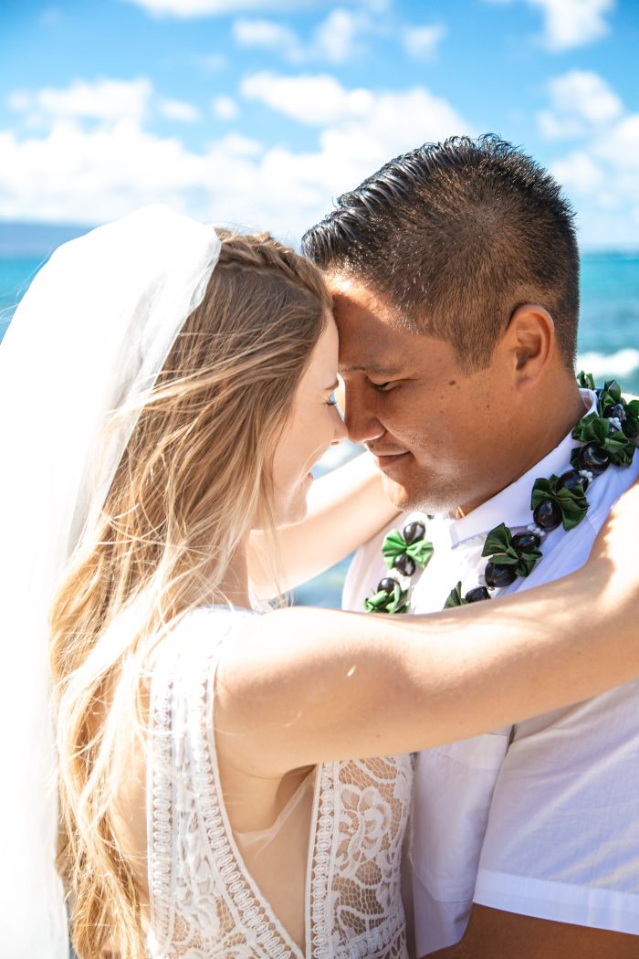 Bride and Groom Embrace in a Sweet Hug on the Beach