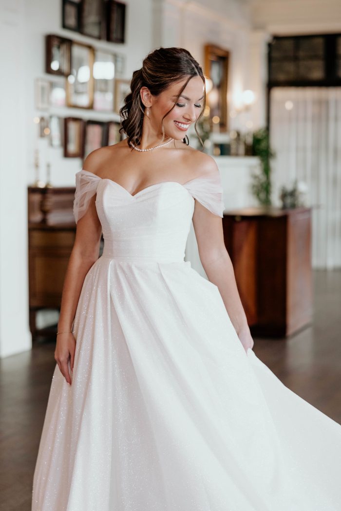 Bride wearing Anniston Marie by Maggie Sottero before her wedding dress preservation