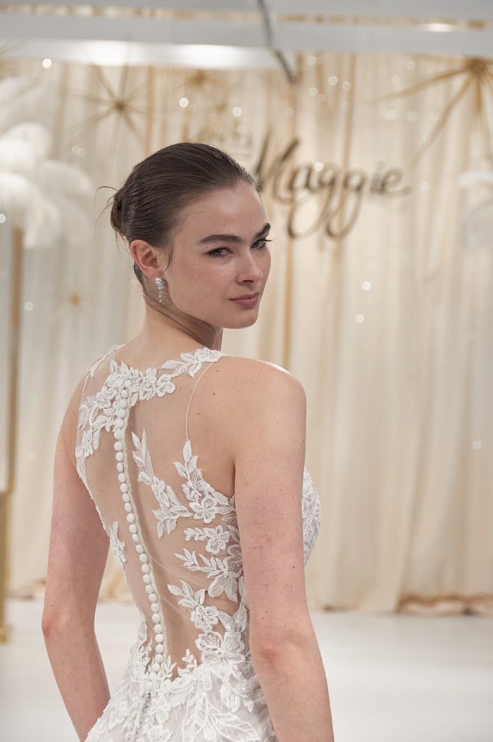 Model Wearing Intricate Backless Wedding Dress Called Kern By Maggie Sottero