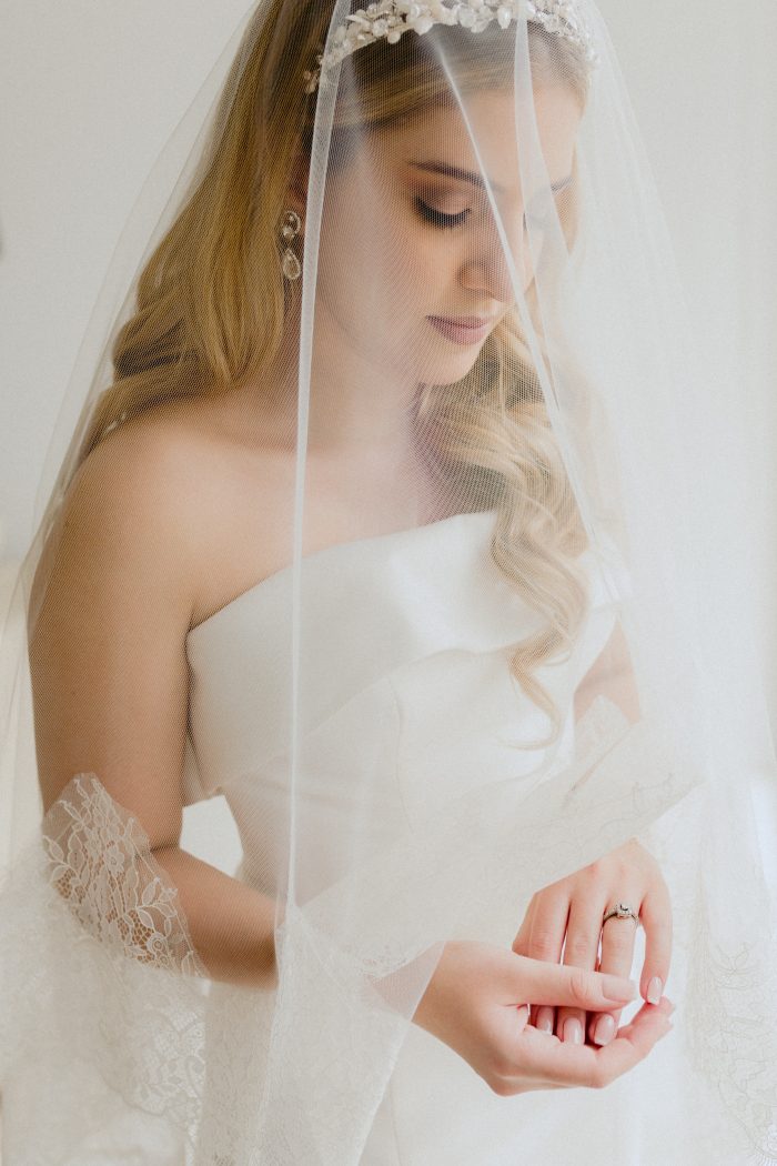 Bride In Satin Wedding Dress Called Mitchell By Maggie Sottero With Engagement Ring