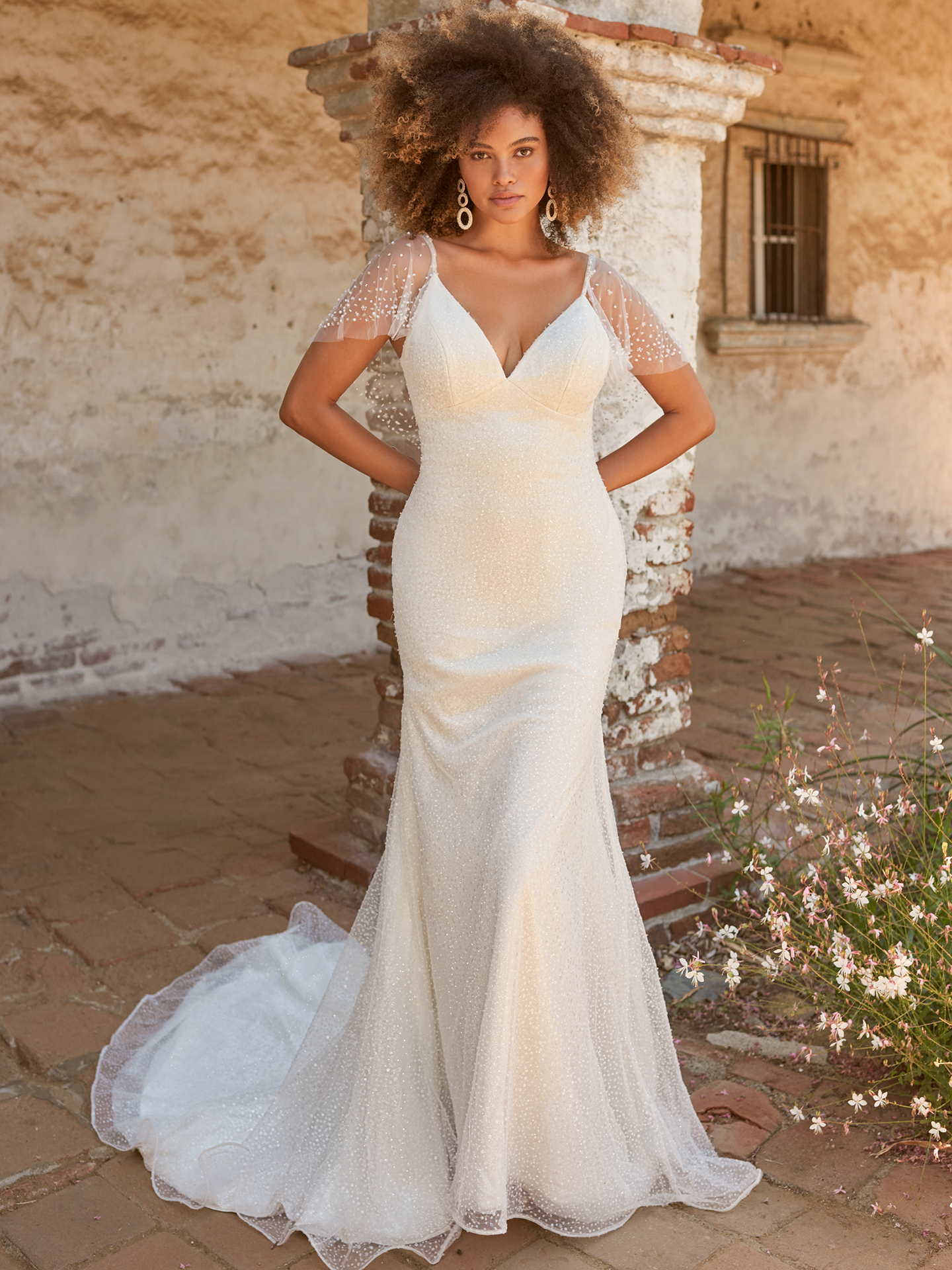 Bride In Pearl Bridal Cape Called Sigourney With Wedding Dress Called Gina By Maggie Sottero