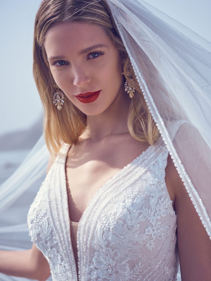Bride In V-Neck Wedding Dress Called Essex By Sottero And Midgley With Ballet Length Veil