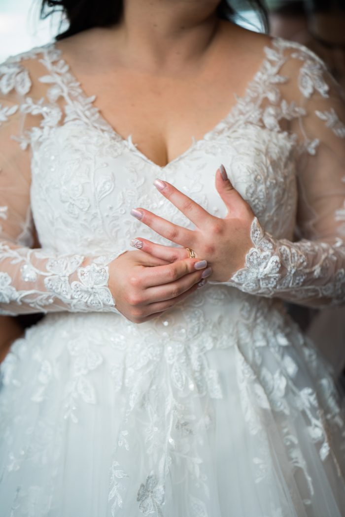 Bride In V-Neckline Wedding Dress Called Tessa By Rebecca Ingram