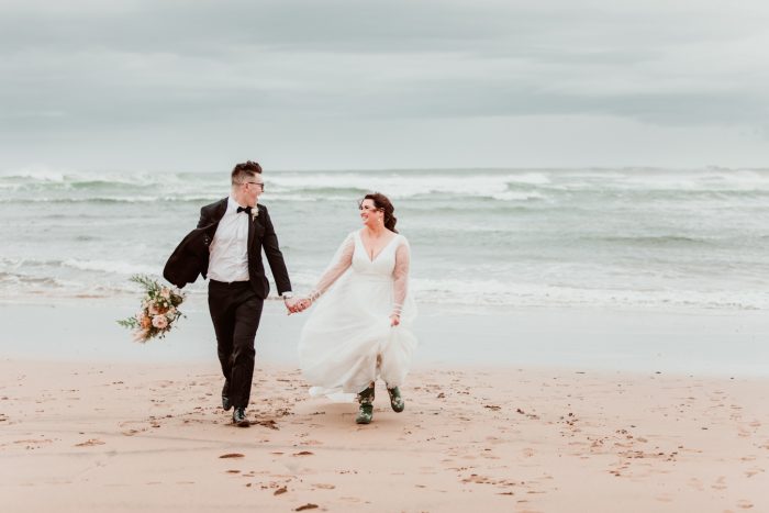 Bride In Simple Wedding Dress Called Joanne By Rebecca Ingram On Beach With Groom