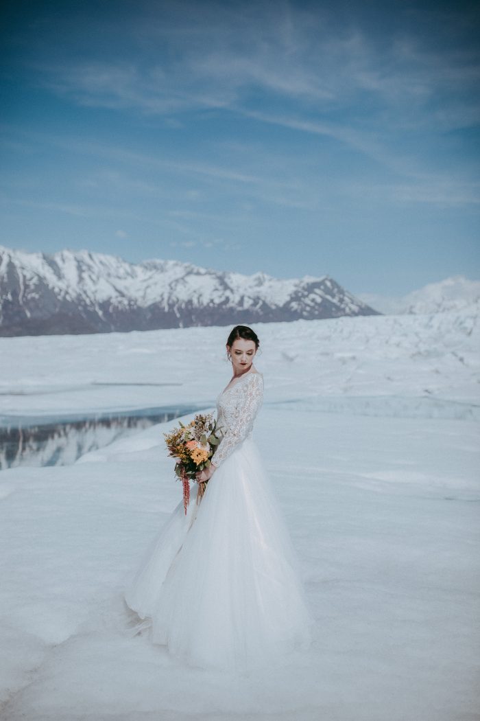 Winter Photography Of Bride Showing Off A Dress Called Mallory Dawn By Maggie Sottero 
