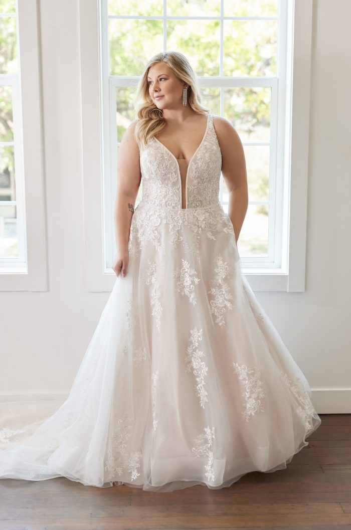 Plus Size Bride Wearing An A-Line Wedding Gown With Deep Plunge Called Leticia Lynette By Maggie Sottero