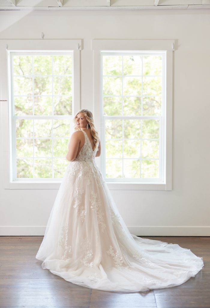 Plus Size Bride Wearing An A-Line Wedding Gown With Deep Plunge Called Leticia Lynette By Maggie Sottero