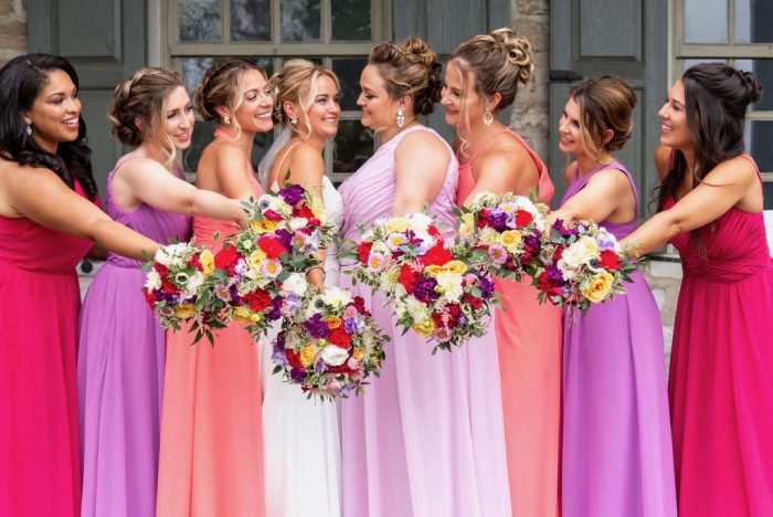Bride Wearing A Dress Called Lorraine By Maggie Sottero Standing With Bridesmaids 