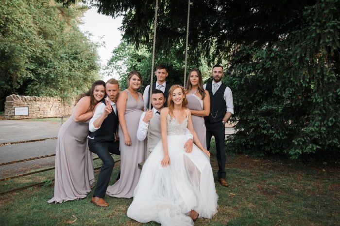 Bride Wearing A Wedding Dress Called Charlene By Maggie Sottero With Her Bridal Party And Husband