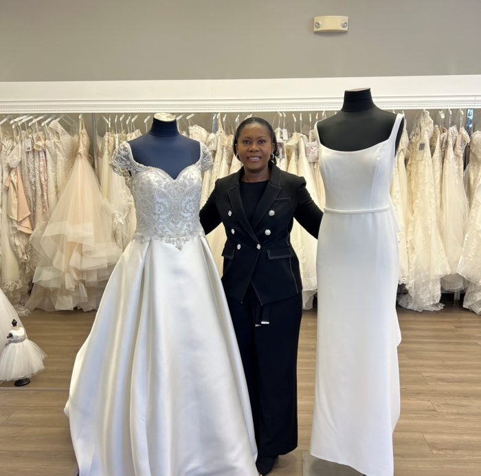 Photo Of Connie Thompson Owner Of Icon Bridal Standing With Mannequins Wearing Maggie Sottero Wedding Gowns