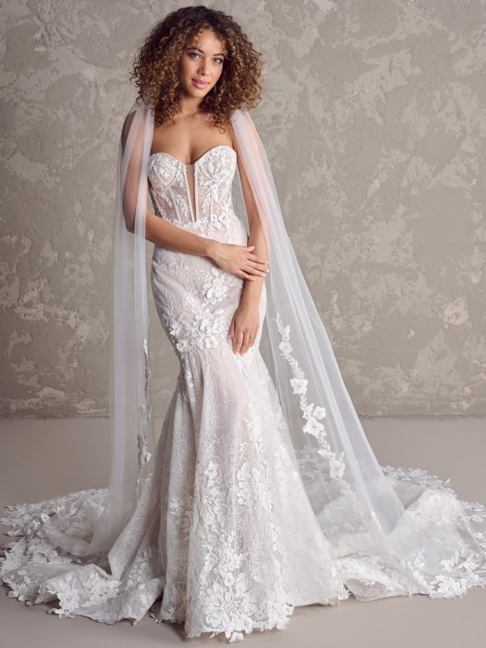 Ortensia fit-and-flare wedding dress featuring a strapless sweetheart neckline, illusion lace bodice with exposed boning, and matte allover lace over a softly flared skirt.
