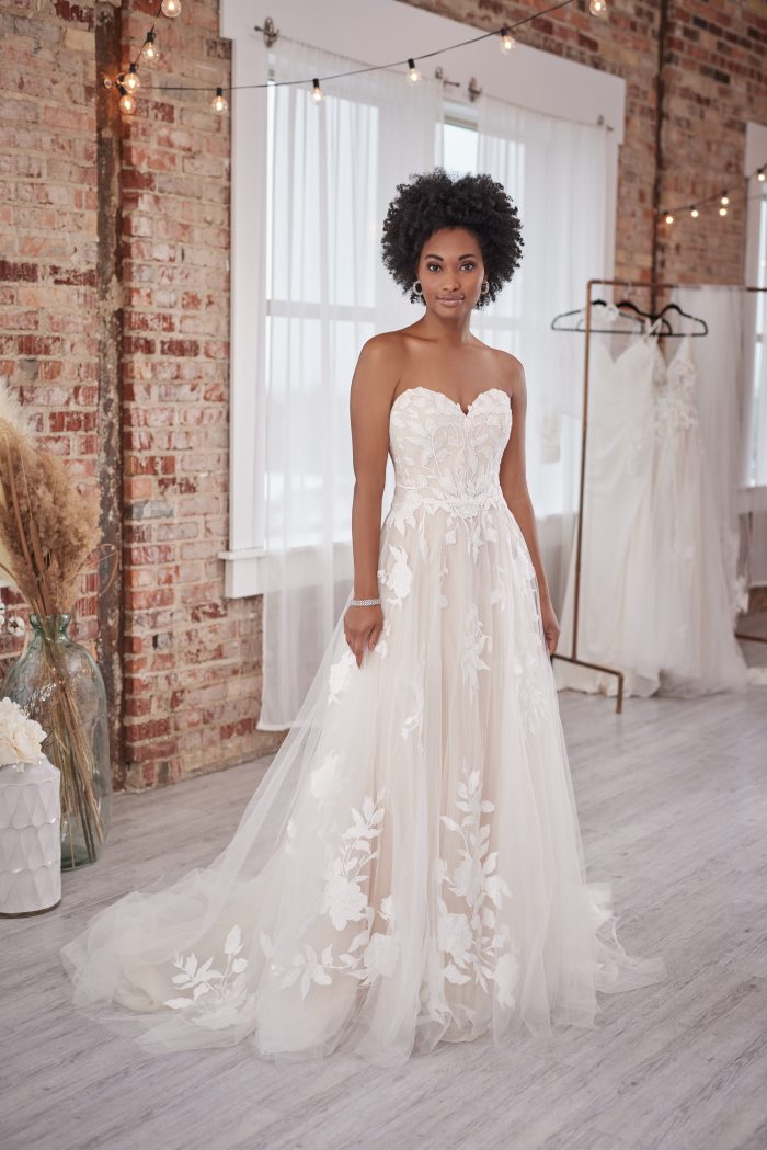 Black Bride Wearing A Sweet A-Line Wedding Gown With Floral Lace Called Hattie Lane Lynette Marie By Rebecca Ingram
