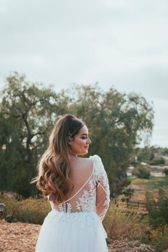 Bride Wearing A Pearl Wedding Dress Called Nikki By Maggie Sottero Standing In A Field