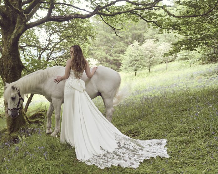 Bride In Chiffon Wedding Dress Called Oksana By Rebecca Ingram