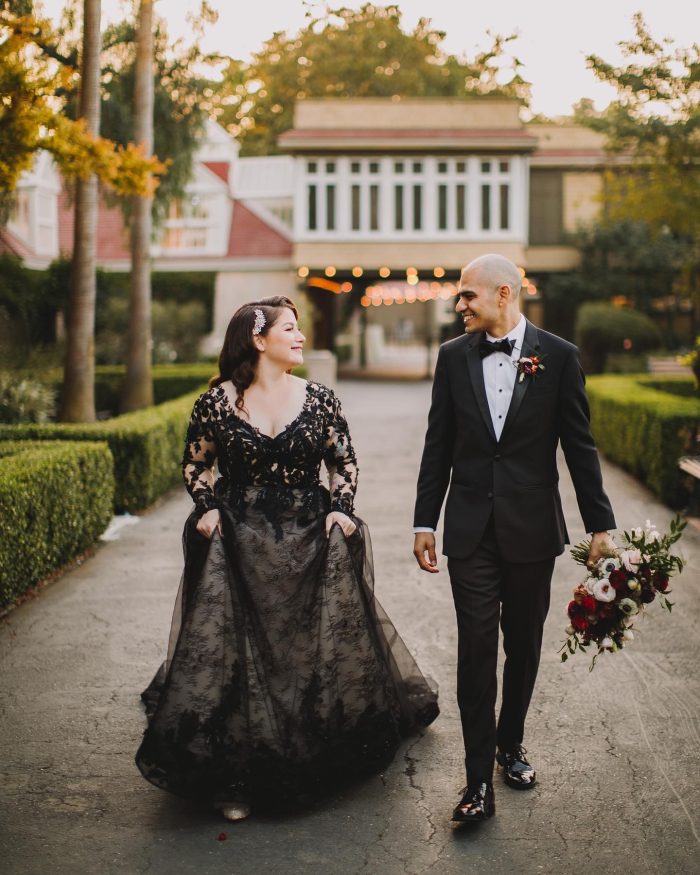 Bride Wearing Black Wedding Dress Called Zander By Sottero And Midgley Walking With Husband