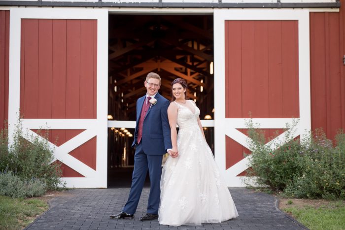 Bride Wearing Meryl By Maggie Sottero Standing In Front Of Red Barn Wedding Venue