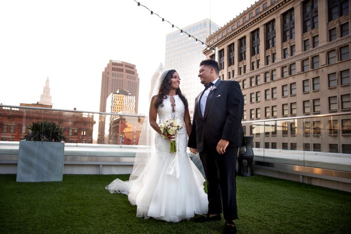Bride Wearing NYC Wedding Dress Called Veda By Sottero And Midgley On City Rooftop With Groom
