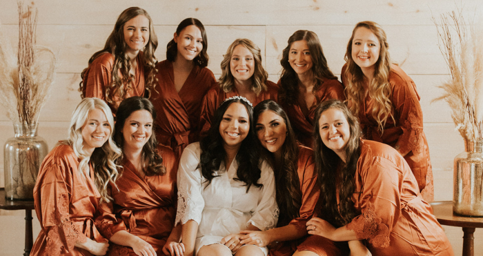 Photo of Bride With Her Bridesmaids Wearing Matching Robes As An Idea For Bridesmaid Gifts