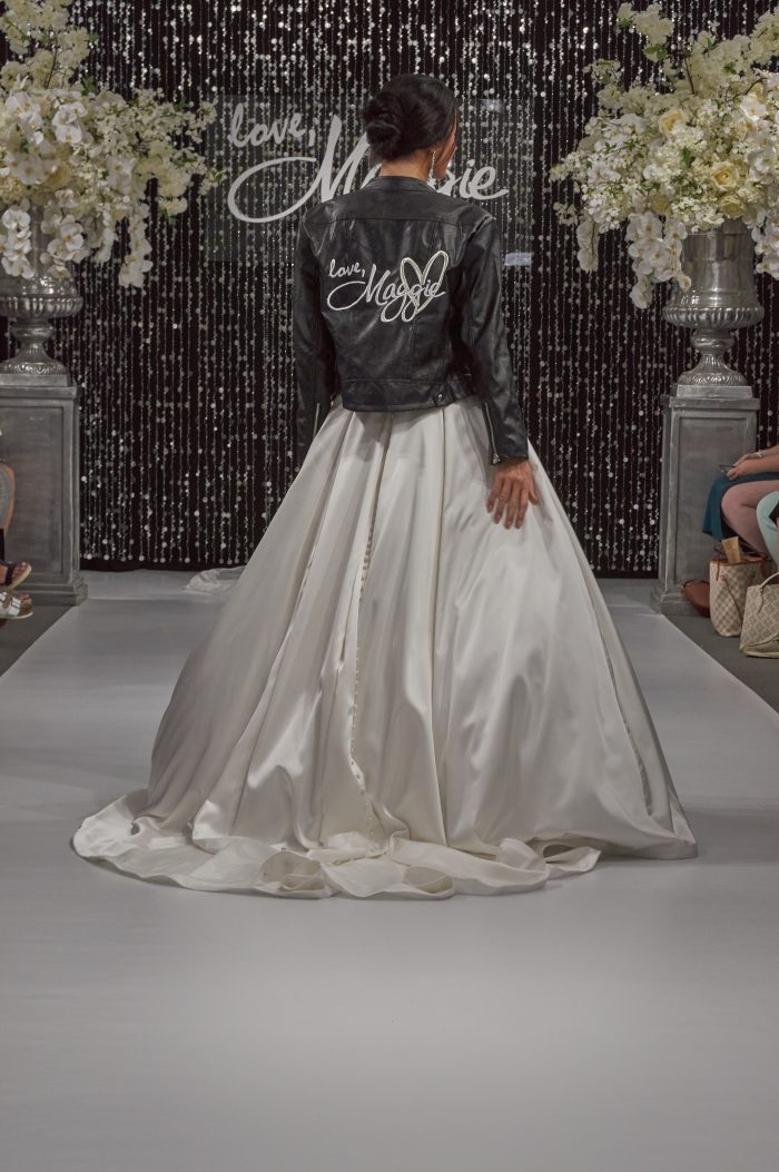 Model In White Ballgown Wedding Dress Called Anniston By Maggie Sottero With Leather Jacket