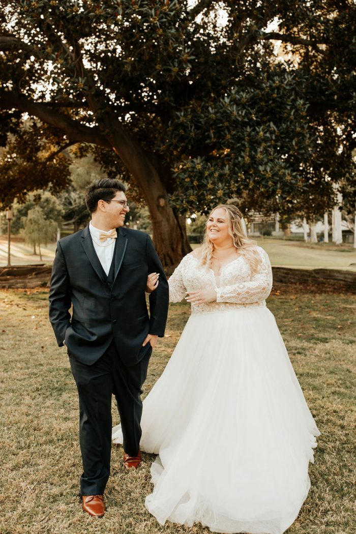 Bride Wearing A Lace Long Sleeved Ballgown With Groom Called Mallory Dawn By Maggie Sottero
