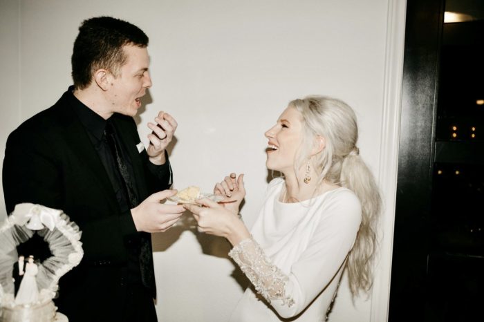 Bride Wearing Simple Wedding Dress With Pearls Called Aston By Sottero And Midgley With Groom Eating Cake