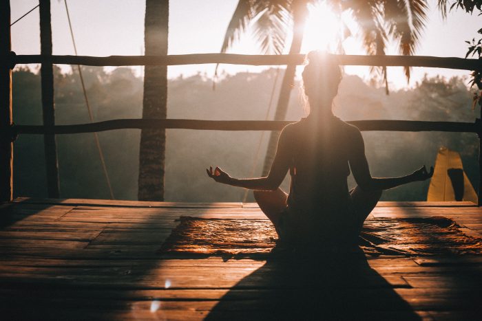 Person Doing Sunset Yoga As A Mental Health Practice For Mental Health Awareness Month