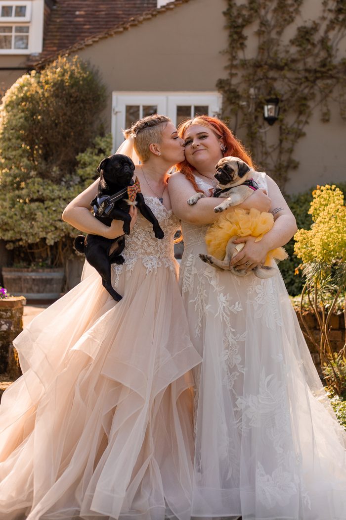 LGBTQ+ Brides Wearing Wedding Dresses Called Anastasia By Maggie Sottero And Priscrilla By Rebecca Ingram With Dogs