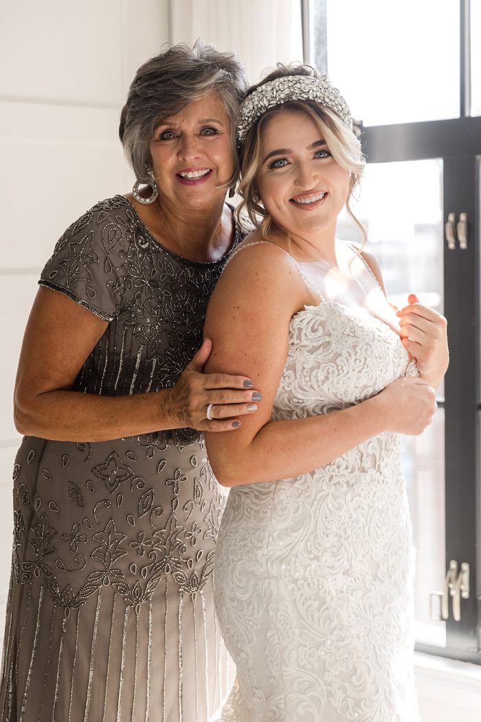 Bride With Mother Of The Bride In A Silver Gown Wearing A Wedding Dress Called Alistaire Lynette By Maggie Sottero