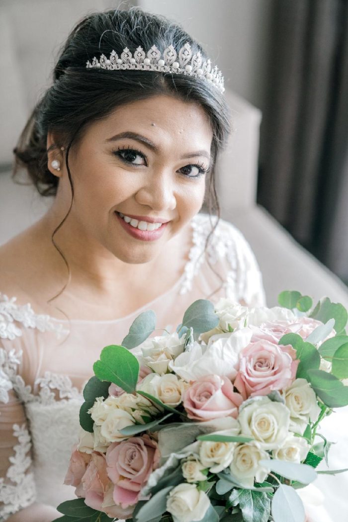 Asian Bride Wearing A Lace Wedding Gown Called Olivia By Rebecca Ingram With Flowers