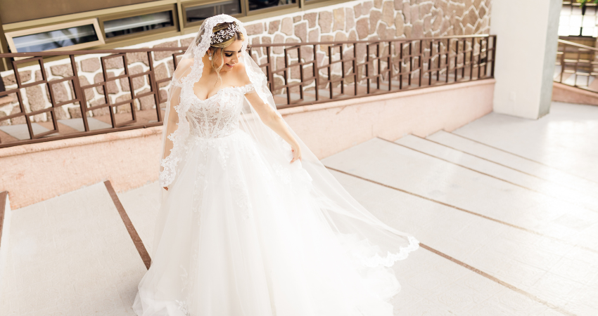 Bride In Off-The-Shoulder Wedding Dress Called Harlem By Maggie Sottero