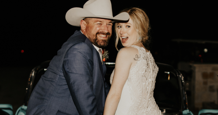 Photo Of Bride In A Western Wedding Dress Called Kevyn By Sottero and Midgley With Groom Wearing A Cowboy Hat