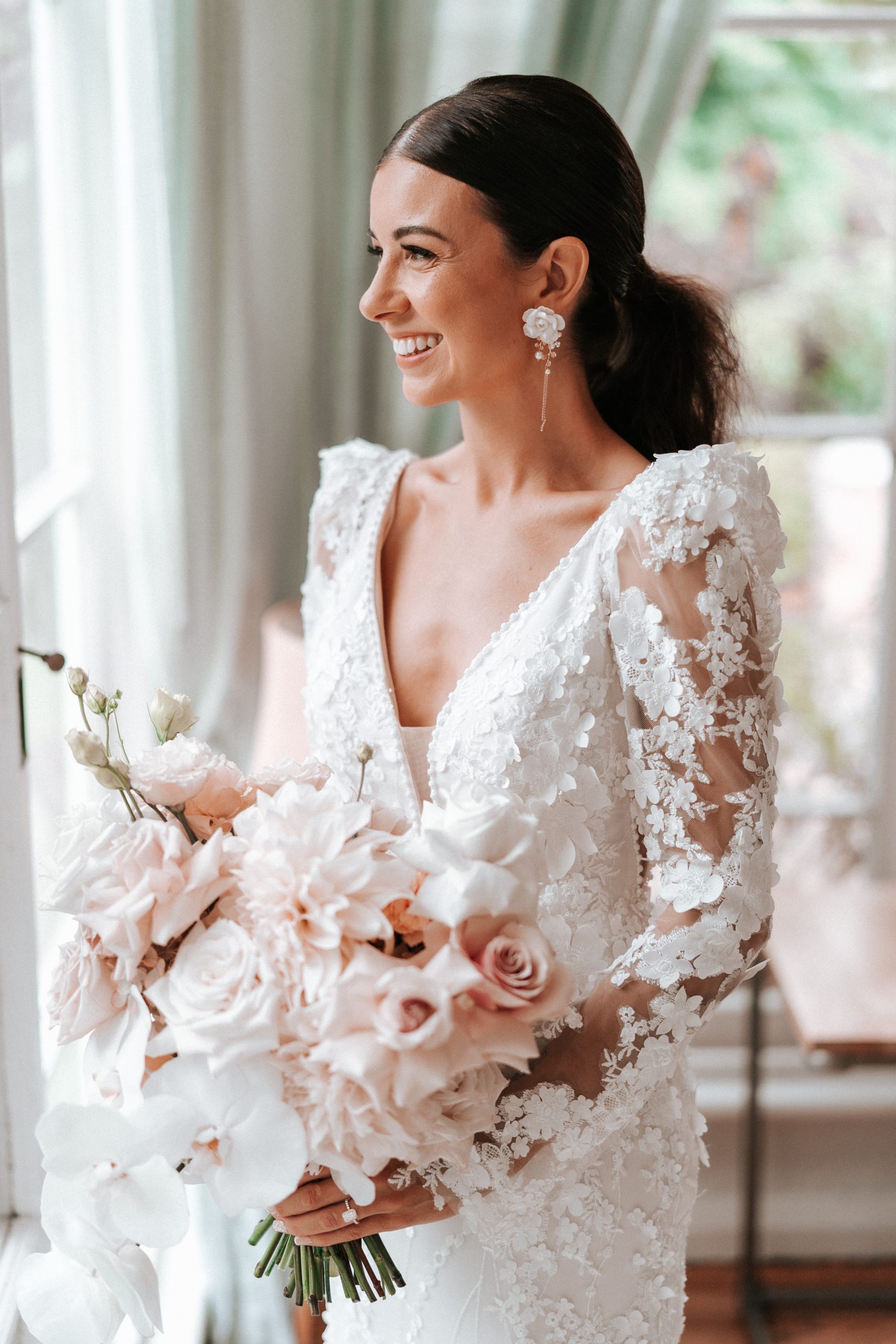 Bride Wearing A Long Sleeve Romantic Summer Wedding Dress Called Cruz By Sottero And Midgley With Pink Florals